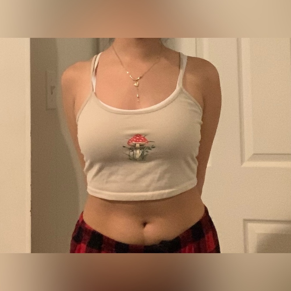 Cream Crop Top with a Red Mushroom logo